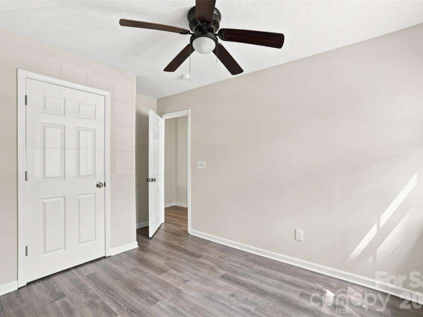 6766 Cypress Tree Lane, Charlotte, NC 28215.  MLS# CAR4415142, YatesRealty ID 16391. Secondary bedroom includes a private closet and ample wall space