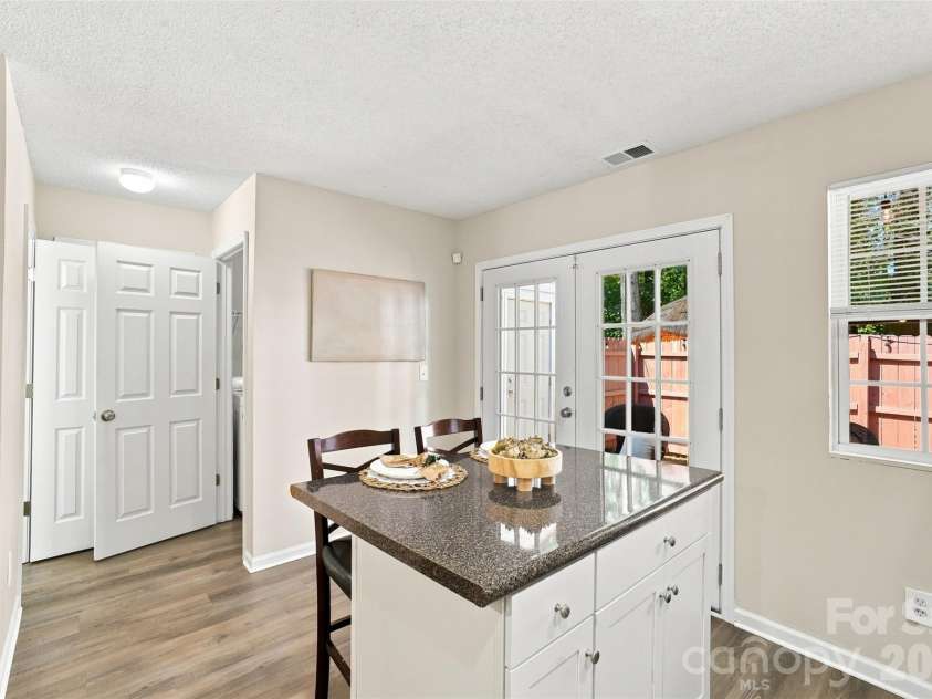 6766 Cypress Tree Lane, Charlotte, NC 28215.  MLS# CAR4415142, YatesRealty ID 16391. Versatile center island offers additional storage, prep space and casual dining