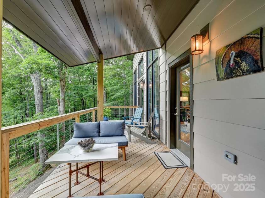 43 Tinkling Springs Lane, Fairview, NC 28730.  MLS# CAR4159981, YatesRealty ID 16392. Covered Porch from Dining Area