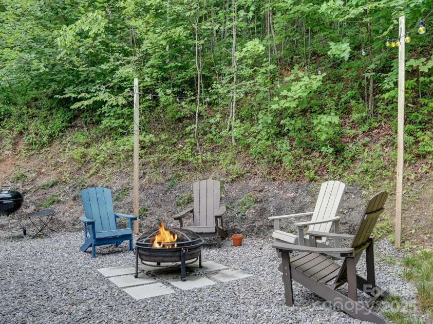 43 Tinkling Springs Lane, Fairview, NC 28730.  MLS# CAR4159981, YatesRealty ID 16392. Fire Pit with Evening Lighting