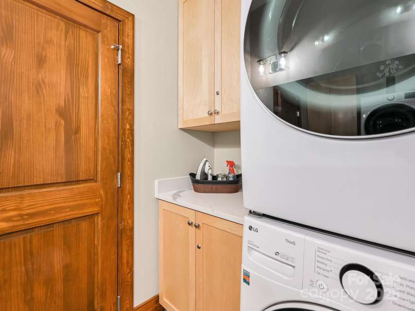 43 Tinkling Springs Lane, Fairview, NC 28730.  MLS# CAR4159981, YatesRealty ID 16392. Laundry Area in Primary En-Suite