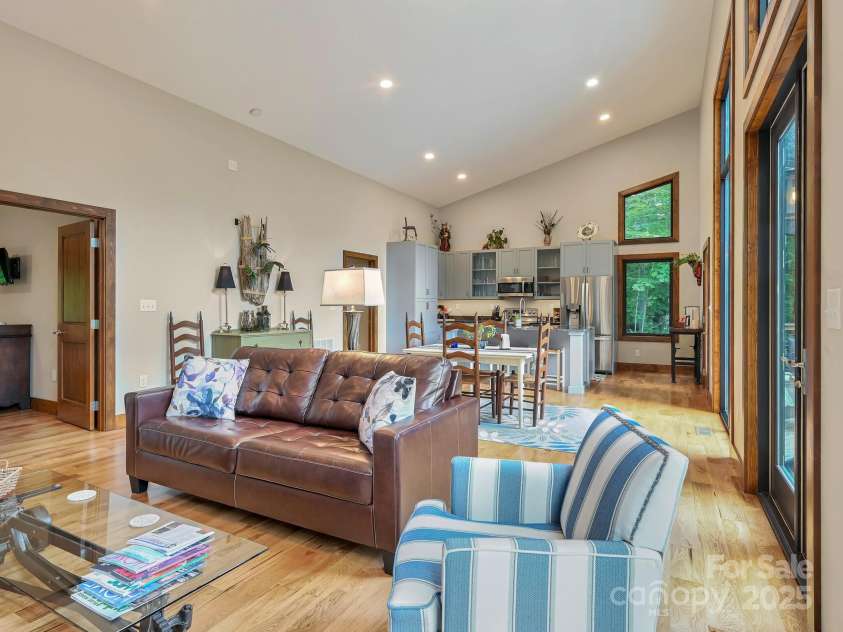 43 Tinkling Springs Lane, Fairview, NC 28730.  MLS# CAR4159981, YatesRealty ID 16392. Living Room to Dining, Deck and Kitchen
