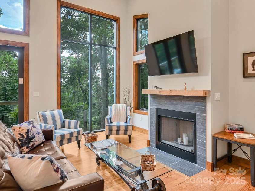 43 Tinkling Springs Lane, Fairview, NC 28730.  MLS# CAR4159981, YatesRealty ID 16392. Living Room with Wood Burning Fireplace