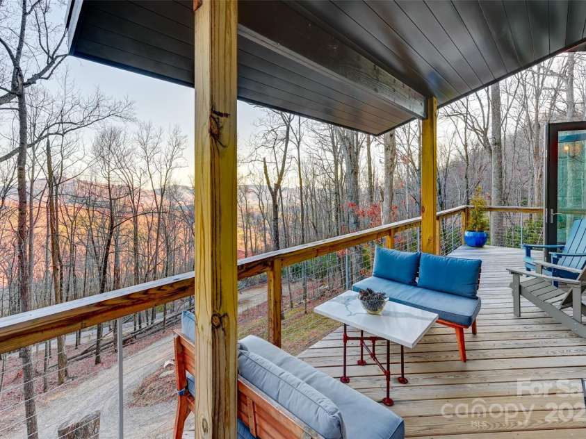 43 Tinkling Springs Lane, Fairview, NC 28730.  MLS# CAR4159981, YatesRealty ID 16392. Winter Evening Deck View