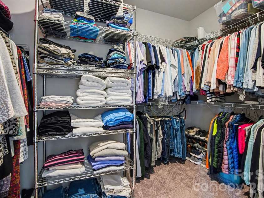 2647 Roseglen Lane, Indian Land, SC 29707.  MLS# CAR4315420, YatesRealty ID 16400. Large primary closet with added shelving