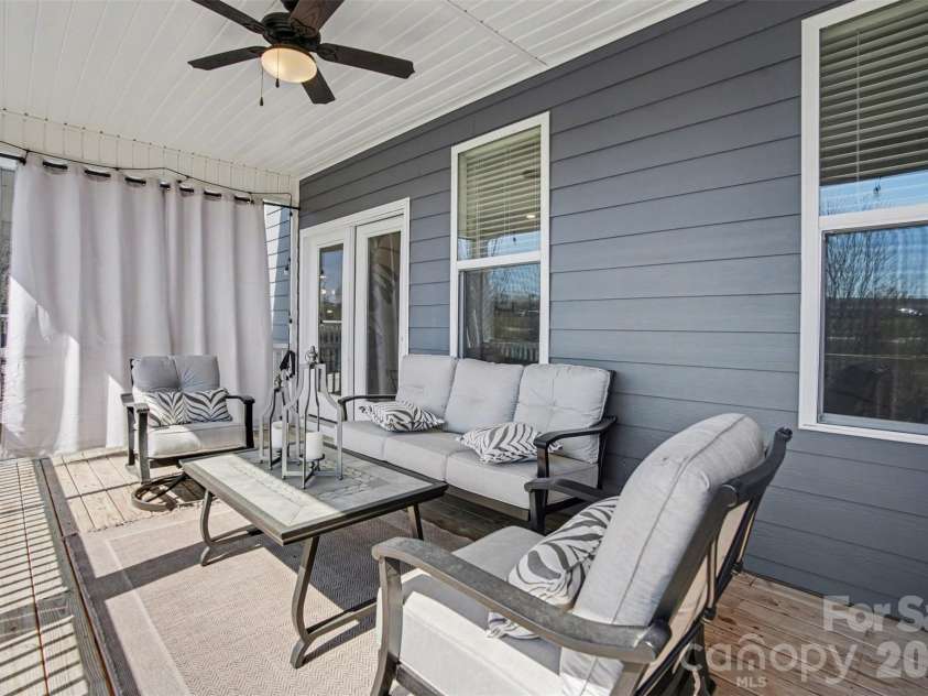 2647 Roseglen Lane, Indian Land, SC 29707.  MLS# CAR4315420, YatesRealty ID 16400. Large screened deck off of living area on main level