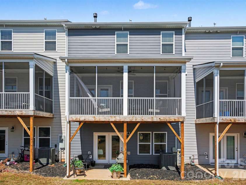2647 Roseglen Lane, Indian Land, SC 29707.  MLS# CAR4315420, YatesRealty ID 16400. Rear elevation with covered patio and screened deck
