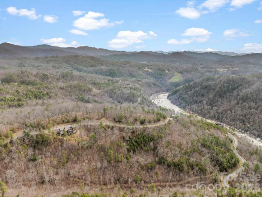 567 Wild River Run, Marshall, NC 28753.  MLS# CAR4353270, YatesRealty ID 16403. Aerial view including the French Broad River.