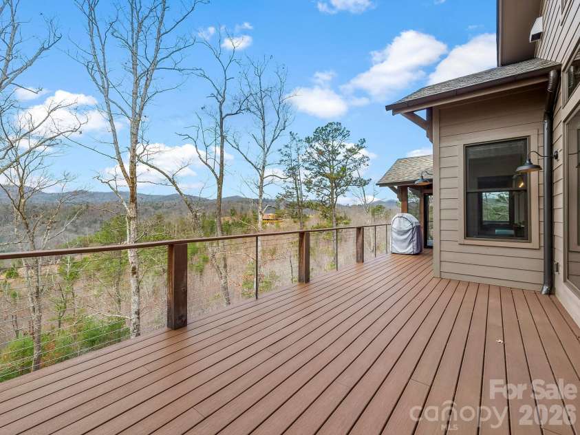 567 Wild River Run, Marshall, NC 28753.  MLS# CAR4353270, YatesRealty ID 16403. Expansive deck on the main level with long-range views.