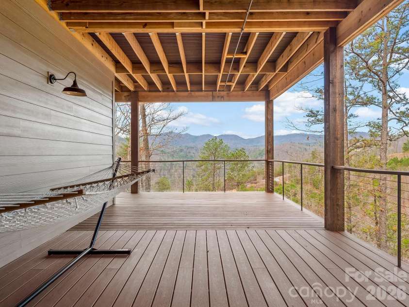 567 Wild River Run, Marshall, NC 28753.  MLS# CAR4353270, YatesRealty ID 16403. Lower level wrap around deck with views.