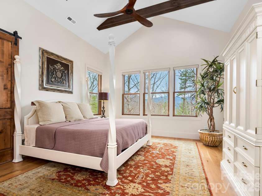 567 Wild River Run, Marshall, NC 28753.  MLS# CAR4353270, YatesRealty ID 16403. Primary bedroom with a view.