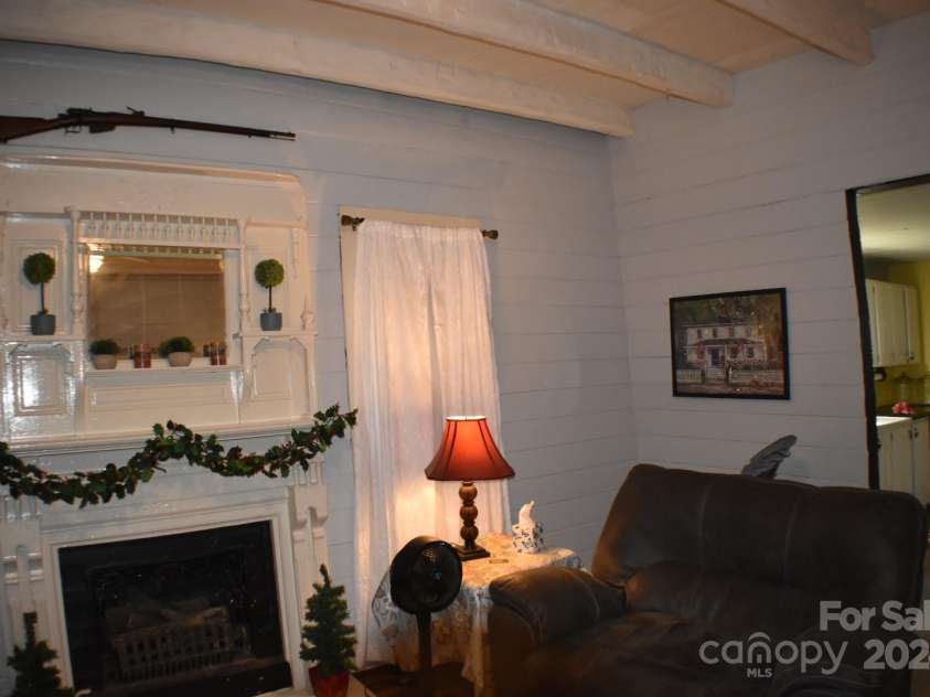 306 McAdenville Road, Lowell, NC 28098.  MLS# CAR4204195, YatesRealty ID 16406. Antique Mantel With Fireplace/Gas Logs