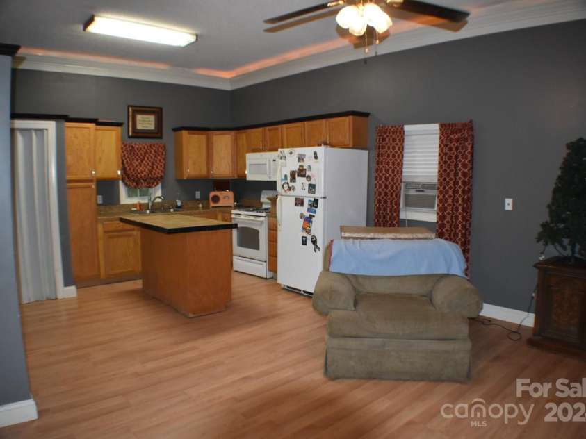 306 McAdenville Road, Lowell, NC 28098.  MLS# CAR4204195, YatesRealty ID 16406. Detached Apartment with Full Kitchen and Open Living Area