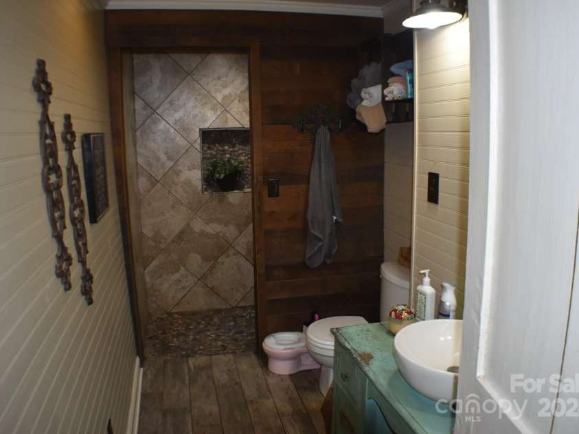 306 McAdenville Road, Lowell, NC 28098.  MLS# CAR4204195, YatesRealty ID 16406. Downstairs Full Bath with Walk-in Shower