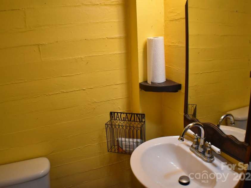 306 McAdenville Road, Lowell, NC 28098.  MLS# CAR4204195, YatesRealty ID 16406. Half Bath in Hair Salon