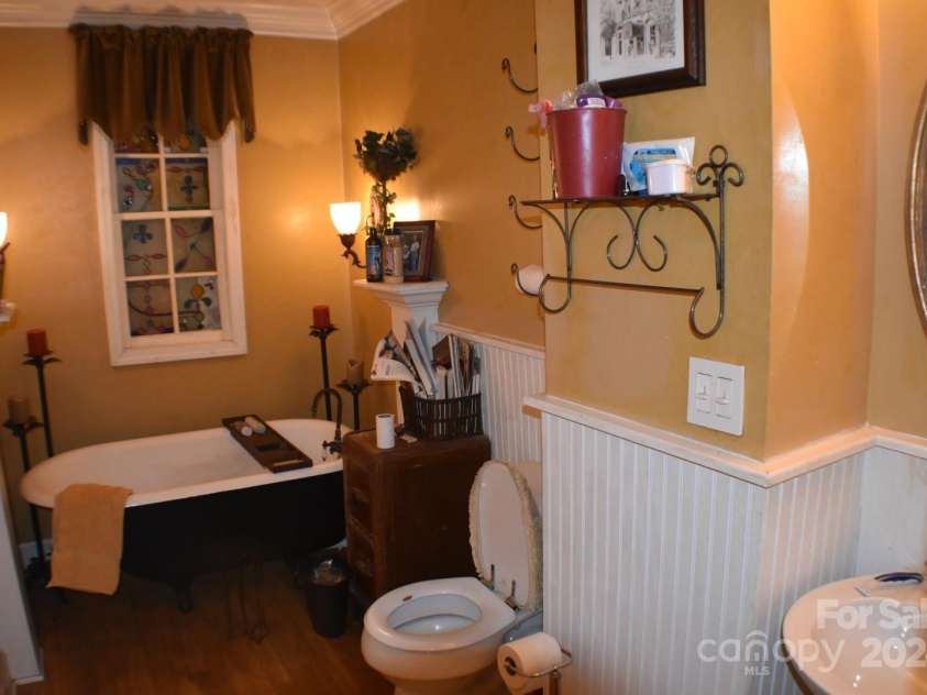 306 McAdenville Road, Lowell, NC 28098.  MLS# CAR4204195, YatesRealty ID 16406. Upstairs Full Bath with Antique Clawfoot Tub