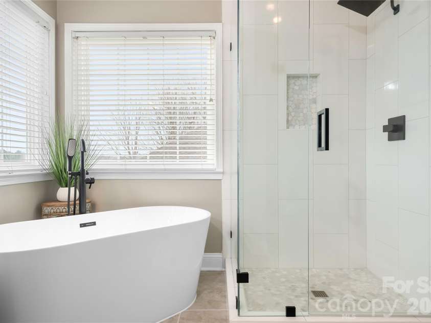 1546 Valhalla Drive, Denver, NC 28037.  MLS# CAR4353456, YatesRealty ID 16408. A spacious shower completes this personal bath. A large primary closet completes the primary suite