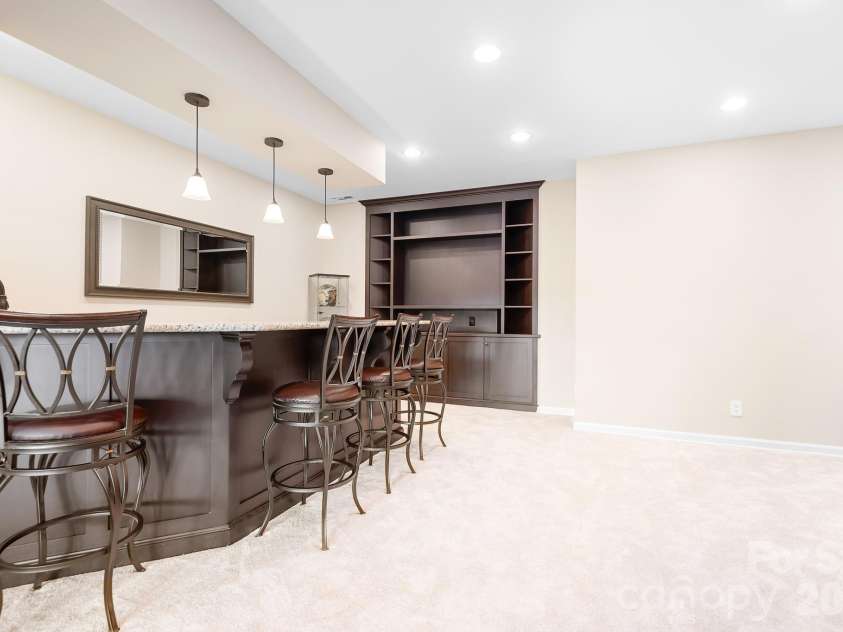 1546 Valhalla Drive, Denver, NC 28037.  MLS# CAR4353456, YatesRealty ID 16408. Drinks anyone! Great entertaining area with room to make this space into whatever your family enjoys. Cards, puzzles, video gaming, etc....