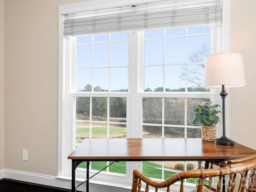 1546 Valhalla Drive, Denver, NC 28037.  MLS# CAR4353456, YatesRealty ID 16408. This is a work space on the main level that has everything you need to interrupt your thought processes! Amazing view of the 7th green, natural spaces and the rear yard.