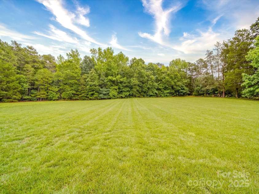 1060 Lentz Harness Shop Road, Mount Pleasant, NC 28124.  MLS# CAR4265582, YatesRealty ID 16422. Back Yard View