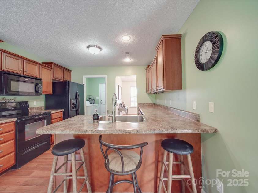 1060 Lentz Harness Shop Road, Mount Pleasant, NC 28124.  MLS# CAR4265582, YatesRealty ID 16422. Kitchen with Breakfast Bar