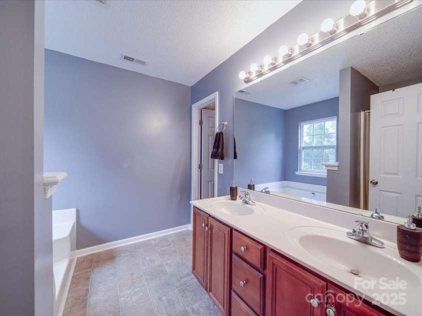 1060 Lentz Harness Shop Road, Mount Pleasant, NC 28124.  MLS# CAR4265582, YatesRealty ID 16422. Primary Bathroom