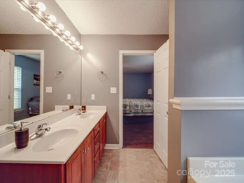 1060 Lentz Harness Shop Road, Mount Pleasant, NC 28124.  MLS# CAR4265582, YatesRealty ID 16422. Primary Bathroom