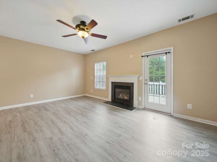 9564 Kings Parade Boulevard, Charlotte, NC 28273.  MLS# CAR4265254, YatesRealty ID 16423. Great Room leads to an outdoor deck area.