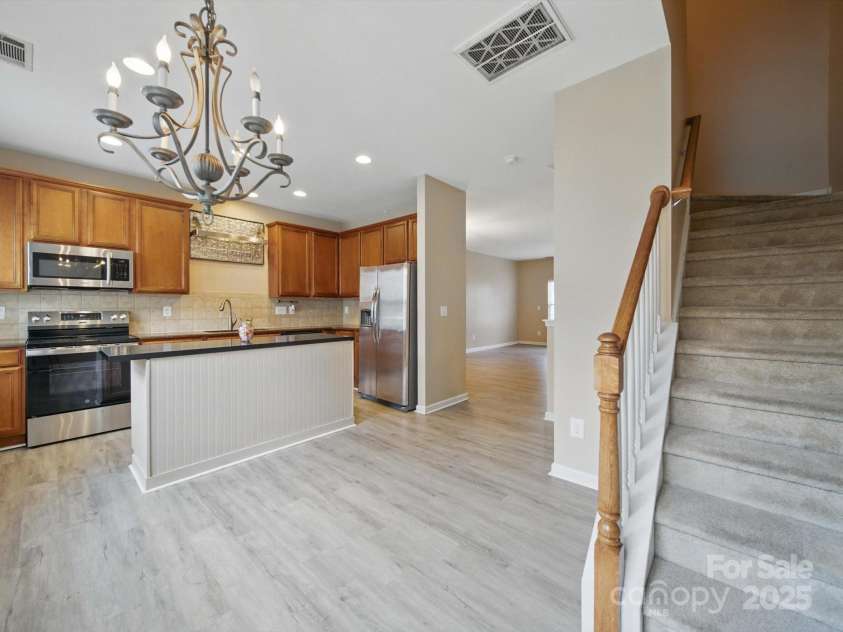 9564 Kings Parade Boulevard, Charlotte, NC 28273.  MLS# CAR4265254, YatesRealty ID 16423. Kitchen with island for meal prep