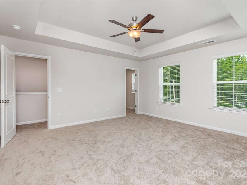 2039 Sadler Woods Lane, Charlotte, NC 28214.  MLS# CAR4265579, YatesRealty ID 16428. Primary bedroom w/ tray ceiling. Representational Photo.