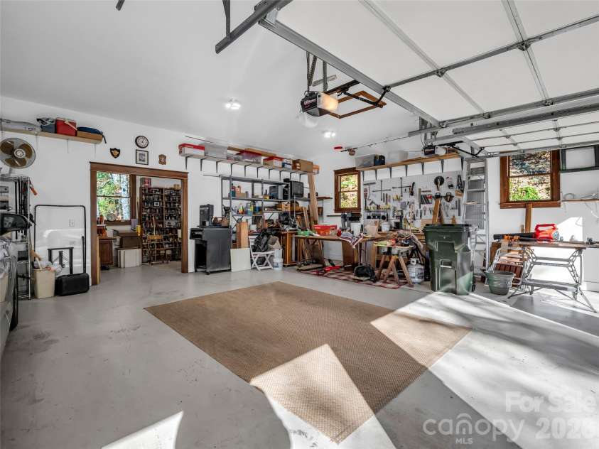 720 Overlook Drive, Flat Rock, NC 28731.  MLS# CAR4365121, YatesRealty ID 16429. Oversized garage with workshop space