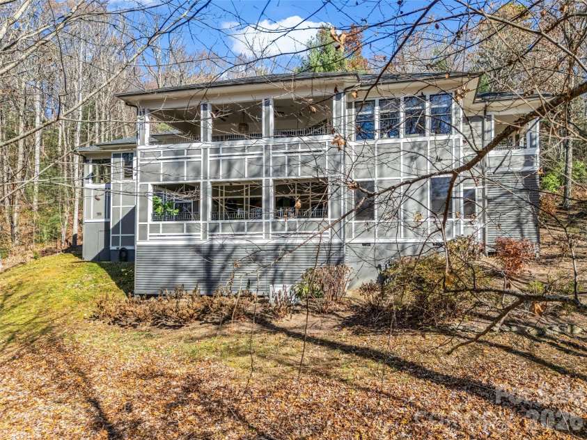 720 Overlook Drive, Flat Rock, NC 28731.  MLS# CAR4365121, YatesRealty ID 16429. Private setting surrounded by mature hardwoods