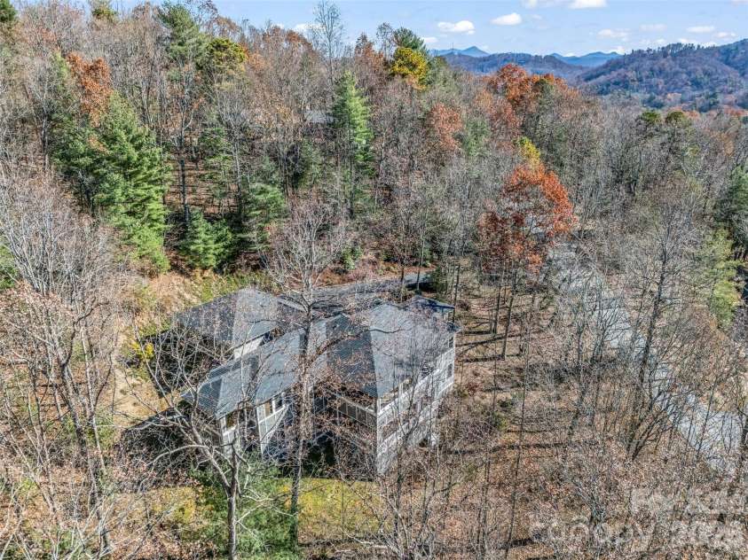 720 Overlook Drive, Flat Rock, NC 28731.  MLS# CAR4365121, YatesRealty ID 16429. Privately positioned on over an acre in Kenmure