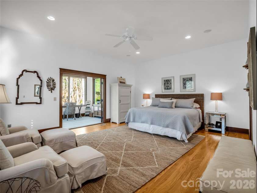 720 Overlook Drive, Flat Rock, NC 28731.  MLS# CAR4365121, YatesRealty ID 16429. Spacious main-level primary suite with serene setting