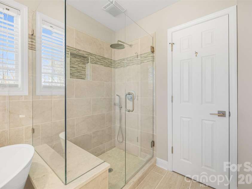 2912 Tallard Lane, Charlotte, NC 28270.  MLS# CAR4336197, YatesRealty ID 16432. Seamless Shower with Custom Tile and Comfort Bench