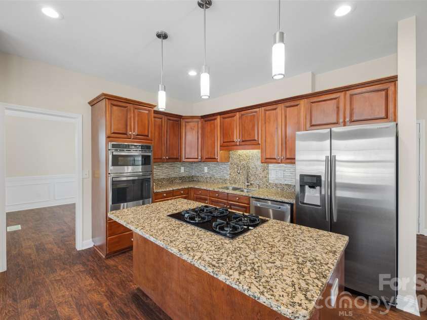 2912 Tallard Lane, Charlotte, NC 28270.  MLS# CAR4336197, YatesRealty ID 16432. Spacious Island with Classic Granite Counters