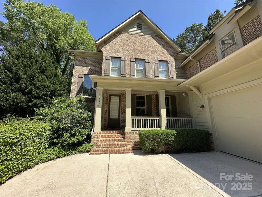 3825 Mountain Cove Drive, Charlotte, NC 28216.  MLS# CAR4254771, YatesRealty ID 16432. Rocking chair front porch