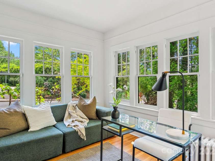21 Sylvan Avenue, Asheville, NC 28801.  MLS# CAR4300108, YatesRealty ID 16433. Sunroom w/ Tons of Windows