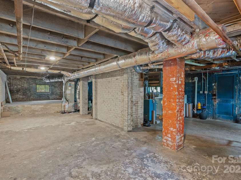 21 Sylvan Avenue, Asheville, NC 28801.  MLS# CAR4300108, YatesRealty ID 16433. Unfinished Basement