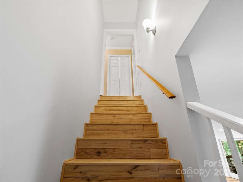 1493 Upper Browns Creek Road, Burnsville, NC 28714.  MLS# CAR4261029, YatesRealty ID 16437. Stairs leading to the 2nd floor