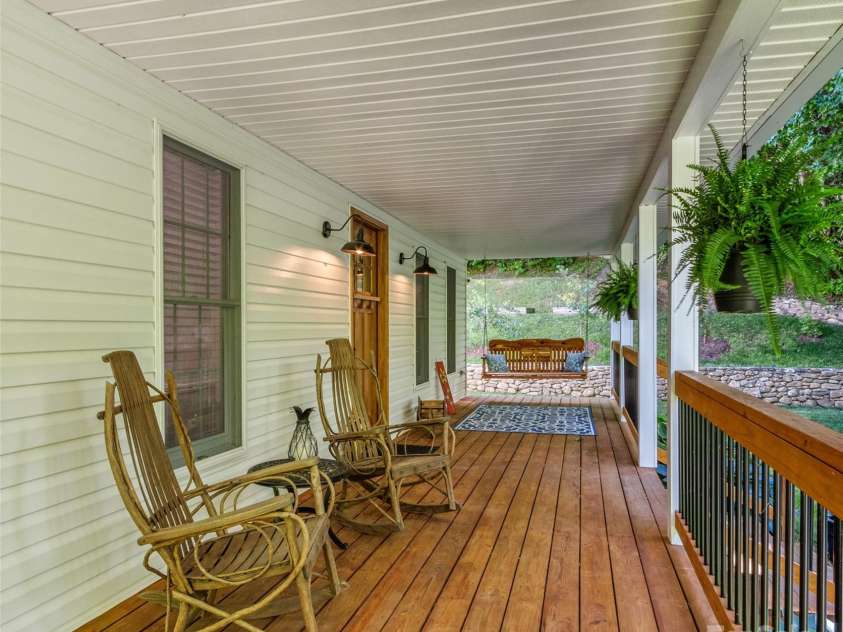 1493 Upper Browns Creek Road, Burnsville, NC 28714.  MLS# CAR4261029, YatesRealty ID 16437. Unwind on this classic rocking chair front porch