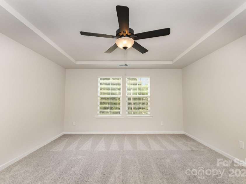 1205 Cathey Road, Charlotte, NC 28214.  MLS# CAR4275203, YatesRealty ID 1644. Primary bedroom w/ ceiling fan. Representational Photo.