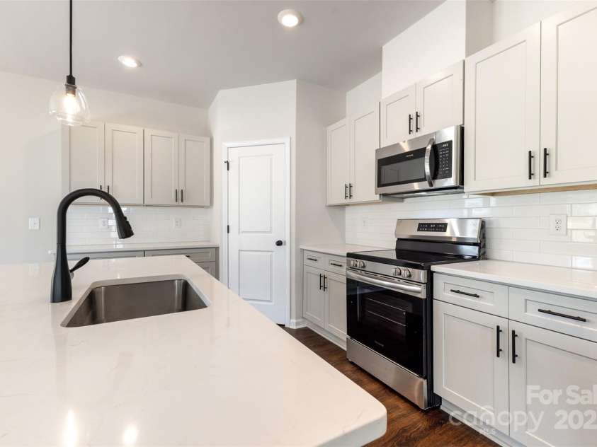 1205 Cathey Road, Charlotte, NC 28214.  MLS# CAR4275203, YatesRealty ID 1644. Quartz countertops. Representational Photo