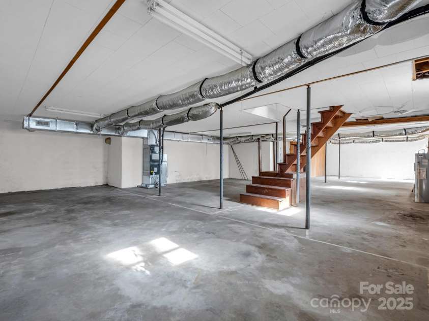 6 Rachel Bell Road, Mill Spring, NC 28756.  MLS# CAR4311830, YatesRealty ID 16446. Basement entrance from interior and exterior