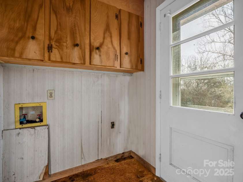 6 Rachel Bell Road, Mill Spring, NC 28756.  MLS# CAR4311830, YatesRealty ID 16446. Laundry area off kitchen, needs updates