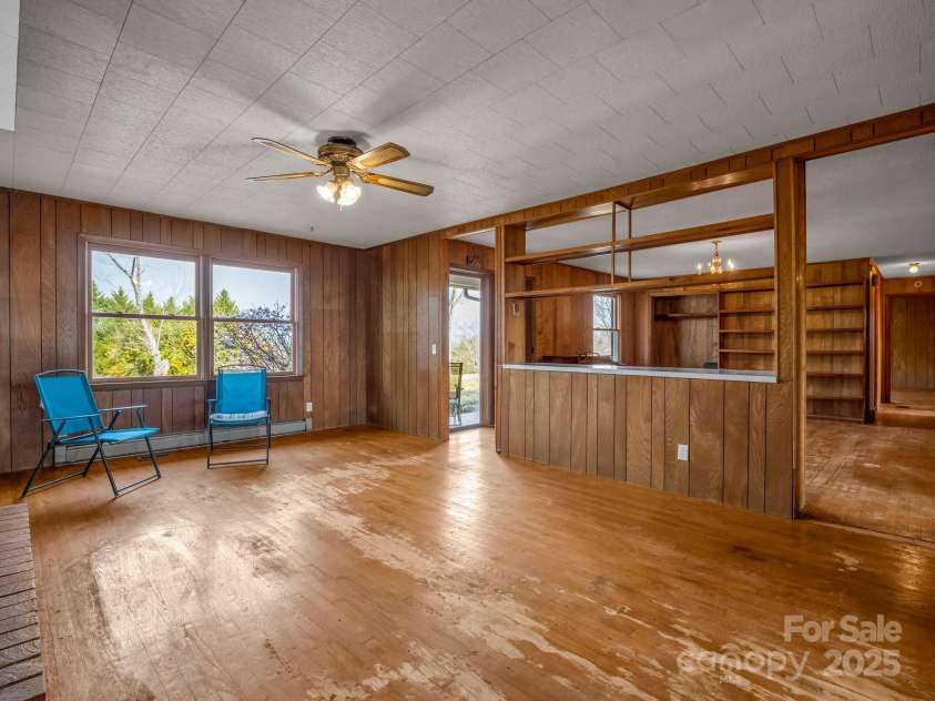 6 Rachel Bell Road, Mill Spring, NC 28756.  MLS# CAR4311830, YatesRealty ID 16446. Living room is open to the dining room