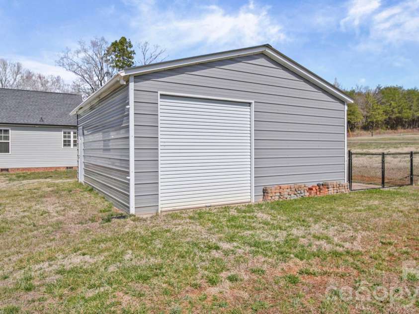 3897 Ritchie Road, Lincolnton, NC 28092.  MLS# CAR4350349, YatesRealty ID 16449. 507 Sq ft storage building. 2 sided doors. Extra parking for RV/Boat etc. 