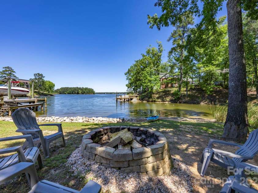 2102 Lake Road, Ridgeway, SC 29130.  MLS# CAR4256737, YatesRealty ID 16450. Fire pit and launch area for kayak or paddleboard.