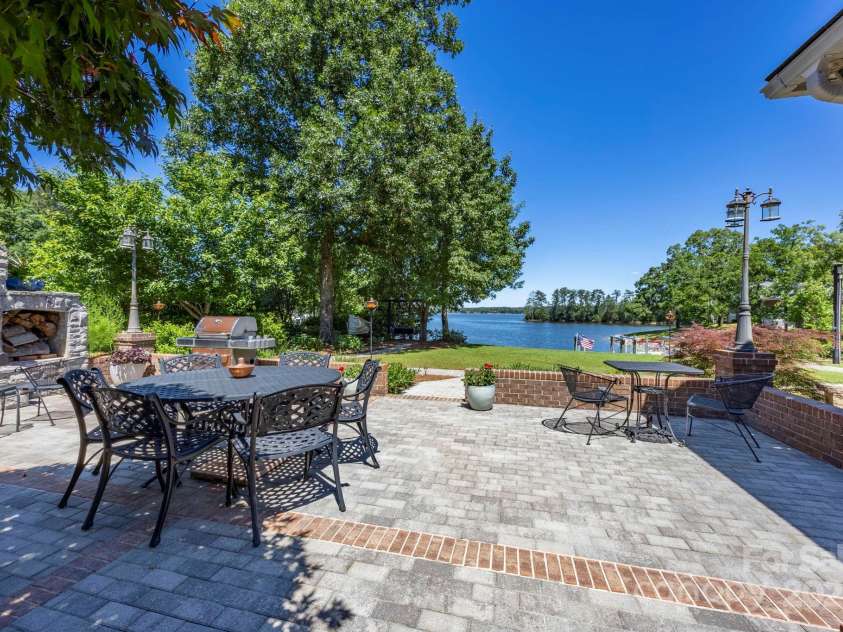 2102 Lake Road, Ridgeway, SC 29130.  MLS# CAR4256737, YatesRealty ID 16450. Paver patio features a woodburning fireplace.