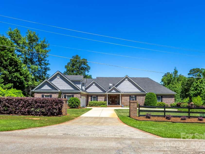 2102 Lake Road, Ridgeway, SC 29130.  MLS# CAR4256737, YatesRealty ID 16450. Road side. Brick home with grey accents.